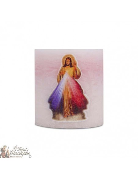 Velas perfumadas y coloreadas en la misa al Cristo Misericordioso