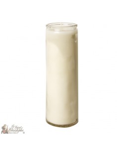 White wax candle in glass container
