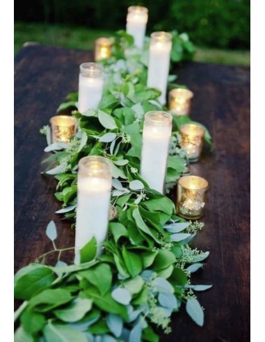 White wax candle in glass container