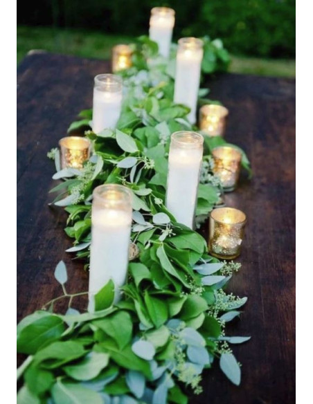 Vela de cera blanca en recipiente de cristal