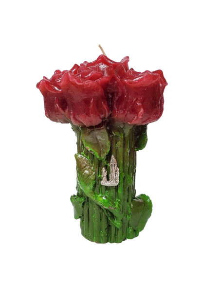 Candle with red rose flowers and Lourdes Apparition pins