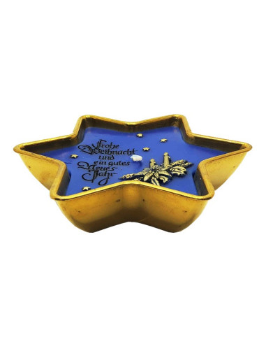 Candela di buon Natale e felice anno nuovo in una ciotola di ottone