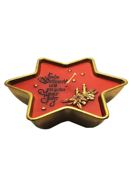 Candela di buon Natale e felice anno nuovo in una ciotola di ottone