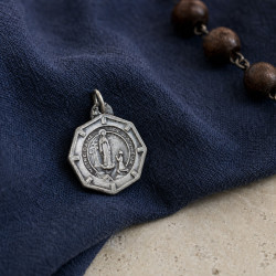 Medal of Our Lady of Banneux and the small chapel