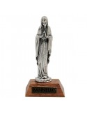 Virgin Mary statue on a wooden base